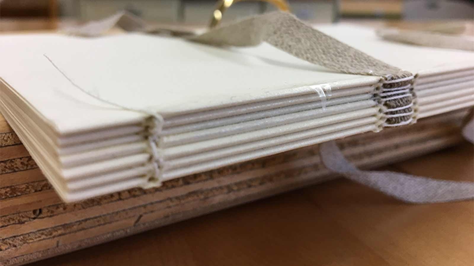 Sewing the spine of the book together!